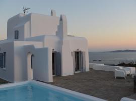 Awesome Mykonos Villa - 5 Bedrooms - Villa Houlston - Great Panoramic Sea Views, къща тип котидж в Fanari