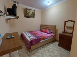 OYO 93757 Rasya Homestay, hotel s parkiralištem u gradu 'Midang'