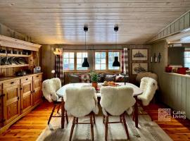 Family-friendly cabin at Sjusj&oslash;en with ski trails, sauna and fireplace, chalet in Ringsaker