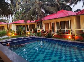 The Sunbliss Cottages, hotel in Morjim