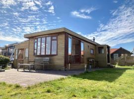 3 pers. Holiday home Sonnenschein with fenced garden and infrared sauna, cabin in Anjum
