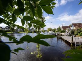 spacious holiday home with private jetty, hotel in Terherne