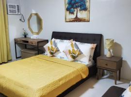 DELUXE ROOM Queen Bed & Sofa Bed with Balcony and Swimming Pool at PPS, viešbutis mieste Puerto Princesa City