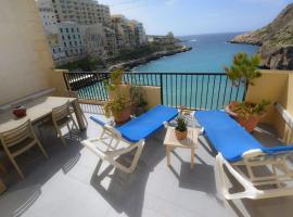 Seafront duplex Penthouse with Terrace overlooking Xlendi Bay, hotel in Xlendi