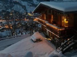 SOMPTUEUX CHALET BARON MEGEVE VUE.Jaccuzi.4 mn a pied au centre, hotel v destinácii Megève