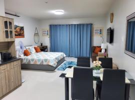 Big Studio Deluxe King Bed & Sofa Bed with Balcony, Swimming Pool & Gym, serviced apartment in Puerto Princesa