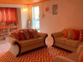 Lovely 2 bedroom condo with WiFi in a quiet area, 7-10 minutes away from both the airport and Oistins, hotel em Christ Church