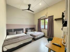 Muslim Homestay Teluk Intan ( Hotel Style Room ) by Mr Homestay, quarto em acomodação popular em Teluk Intan