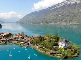 Romantic Swiss Alp Iseltwald with Lake & Mountains