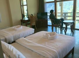 Whispering Woods Resort, готель у місті Тхімпху