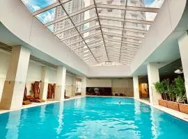 Luxury condo on 18th floor with pool, fitness, parking included.