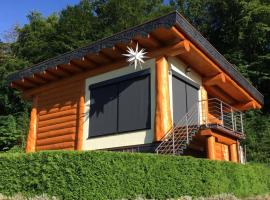 Canadian log house, hotel met zwembaden in Stuer