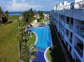 Sonia Flats Tabatinga - Flat térreo em condominio à beira mar, hotel com estacionamento em Nísia Floresta