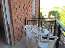 Cozy apartment with terrace - Beahost, lodging in Bibione