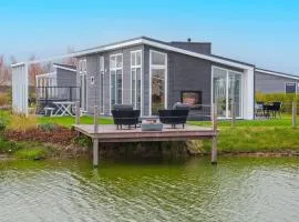 Modern chalet on the water at a holiday park