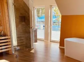 Ferienhaus Am Hafen 12 Altwarp mit Sauna, Kamin und Wasserblick