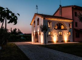Schöne Ferienwohnung mit rustikalem Flair, direkt am Fluss Sile und nicht weit entfernt von der Altstadt Treviso, מלון בSilea