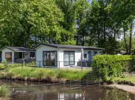 Modern chalet with a terrace and near a pond