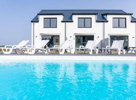 Cichy Domek Apartamenty - Podgrzewany Basen, alquiler vacacional en la playa en Karwia