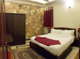 Triple One Hotel Suites, hotel em Abbottabad