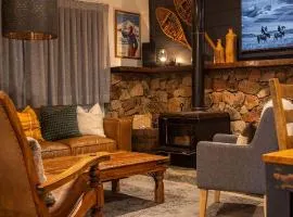 Crackenback Castle free standing chalet with fire place