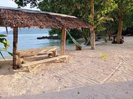 Hideaway Paradise Beach Bungalows, rumah tamu di Hog Harbour