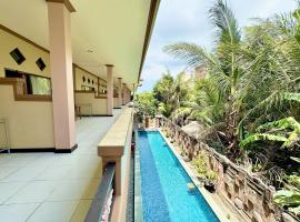 Taxa Raya Guest House, rumah tamu di Legian