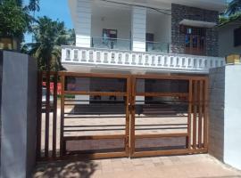 Whitehouse Homestay-Iqra Hospital Calicut, rum i privatbostad i Kozhikode