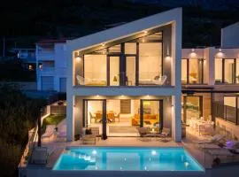 NEW! Three-bedroom Villa Sunshine with a heated pool, media room, and views of the sea