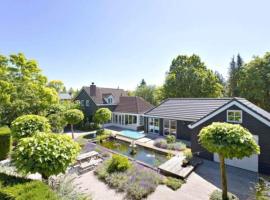 Spot Elst vakantiehuis, hotel amb banyeres d'hidromassatge a Elst