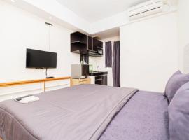 Pelangi Rooms By Reccoma, apartmen di Pondokcabe Hilir