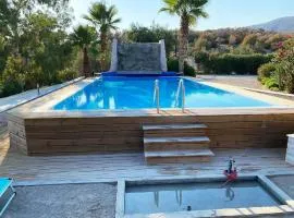 Ferienhaus in Ermioni mit Grill, gemeinschaftlichem Pool und Terrasse