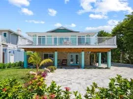 Go to the beach from expansive heated pool home