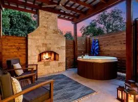 An Enchanted Hideaway outdoor fireplace hot tub