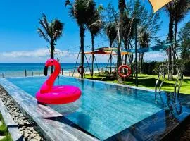 Whispering waves beachfront villa