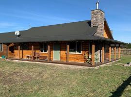 The Log Cottage, hotel en Christchurch