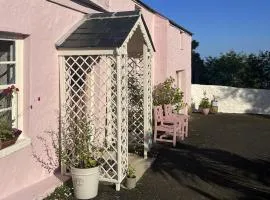 The Pink Cottage (upstairs suite) & Secret Garden