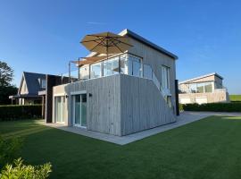 Villa Maroma Mistral Veerse Meer , 4 E-bikes gratis laden, EV trampoline, Hotel in Kamperland
