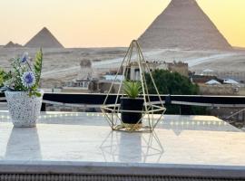Golden Pyramids View Inn, proprietate de vacanță aproape de plajă din Cairo