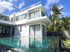 Your Ideal Beachfront Villa for a Perfect Vacation，Riambel的小屋