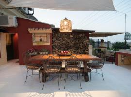 Zoe's Yard family Summer House at Mon Repos, Hotel in Anemómylos