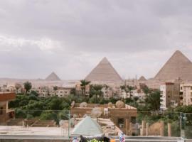 Tuya Pyramids Hotel Inn, хотел в Кайро