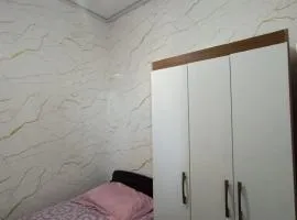 Quarto em Apartamento no Centro