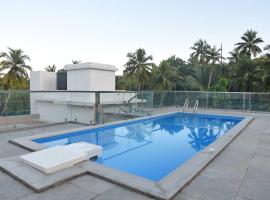 Ranghavi sands Apartment with Pool - near beach and Dabolim Airport、ボグマロのアパートメント