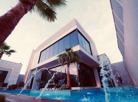 Pool villa فيلا من ثلاث غرف نوم, villa i Butainiyāt