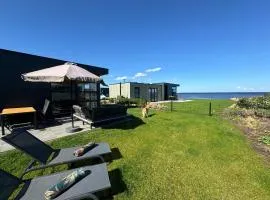 Enkhuizer Strand Chalet IJsselmeerblick Zweite Reihe mit Zaun Haus Nr 221