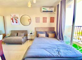 Cozy Condo near Airport with Pool and Ocean View, Ferienwohnung in Suba