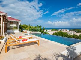 Résidence Les Raisins Clairs - Villas standing 4 étoiles , vue sur mer panoramique & piscine à débordement, holiday home in Saint-François