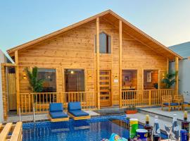 أكواخ الخليج - Gulf Cottages, шале у місті Khalij Salman