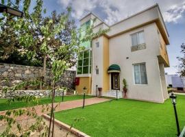 نزل فلل الريف alreef villas, hotell med bubbelbad i Baljurashi